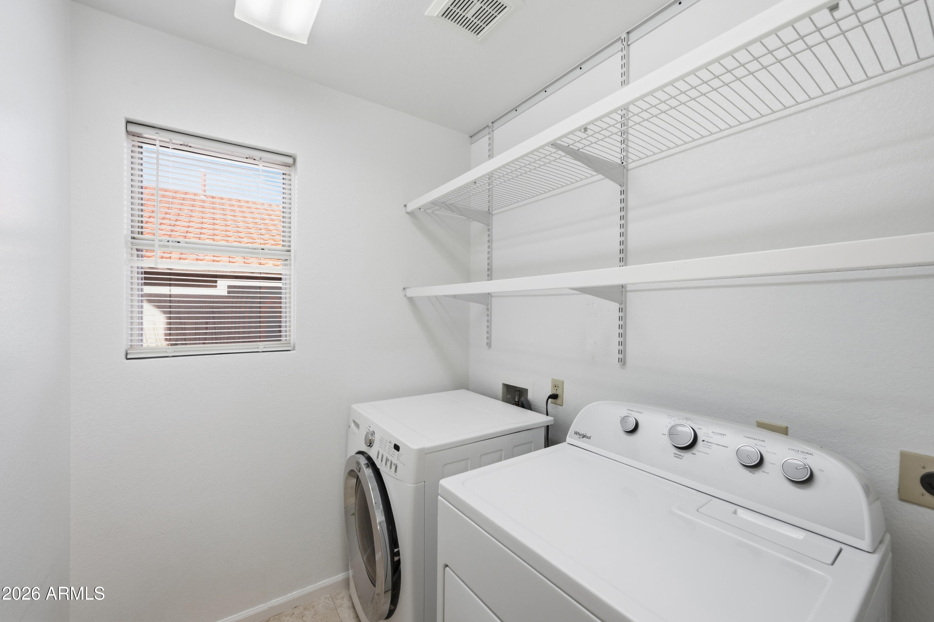 9502 East Presidio Road Scottsdale, AZ 85260 - Photo 21 of 39 a view of storage and utility room with washer and dryer