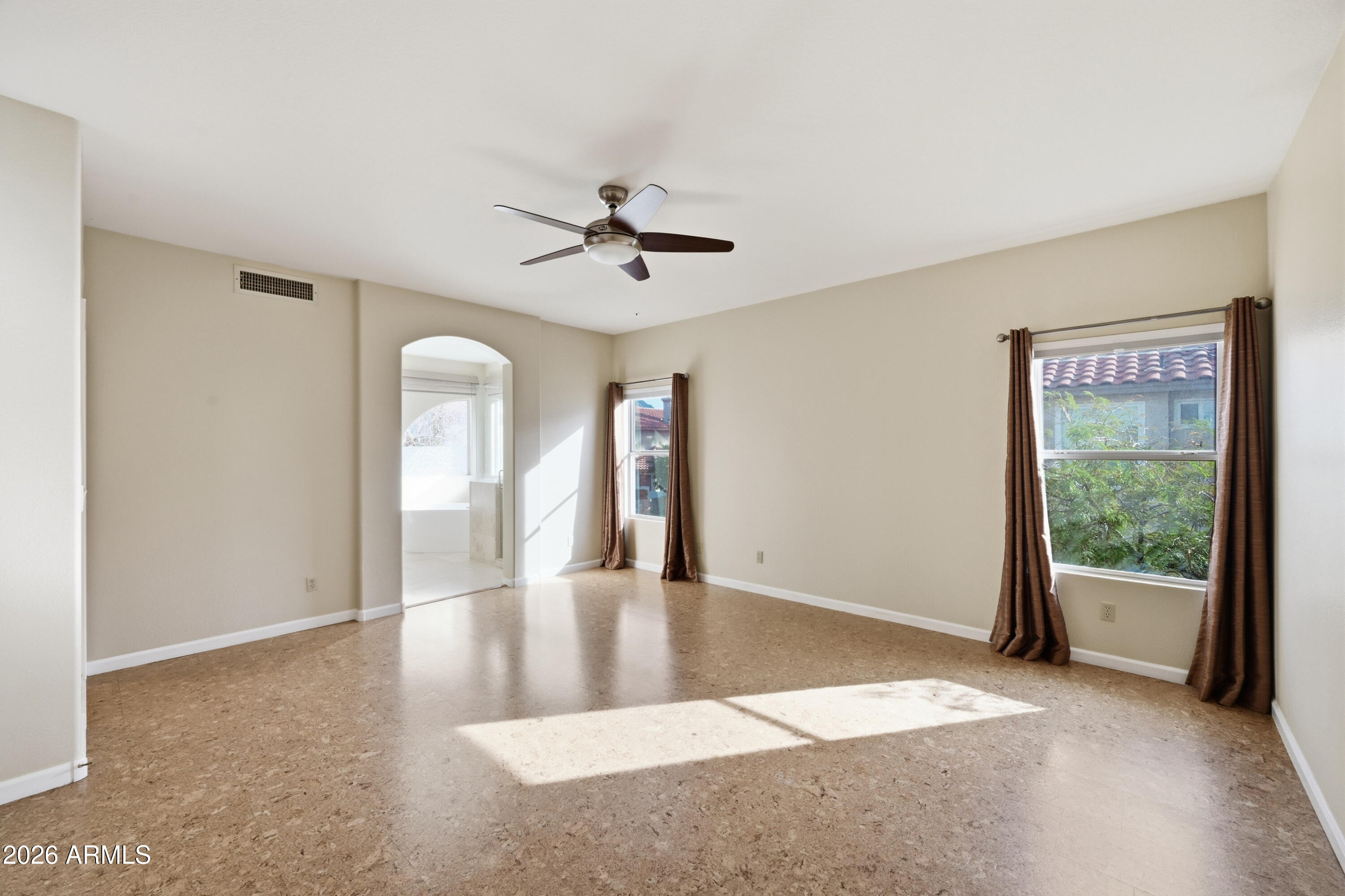 9502 East Presidio Road Scottsdale, AZ 85260 - Photo 24 of 39 a view of a livingroom with a ceiling fan and window