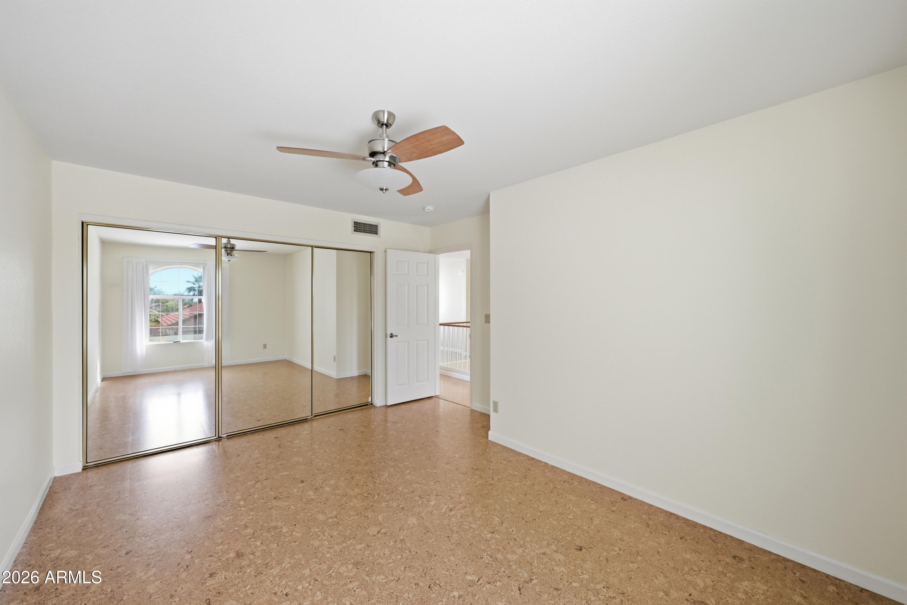 9502 East Presidio Road Scottsdale, AZ 85260 - Photo 32 of 39 a view of a livingroom with a ceiling fan and window