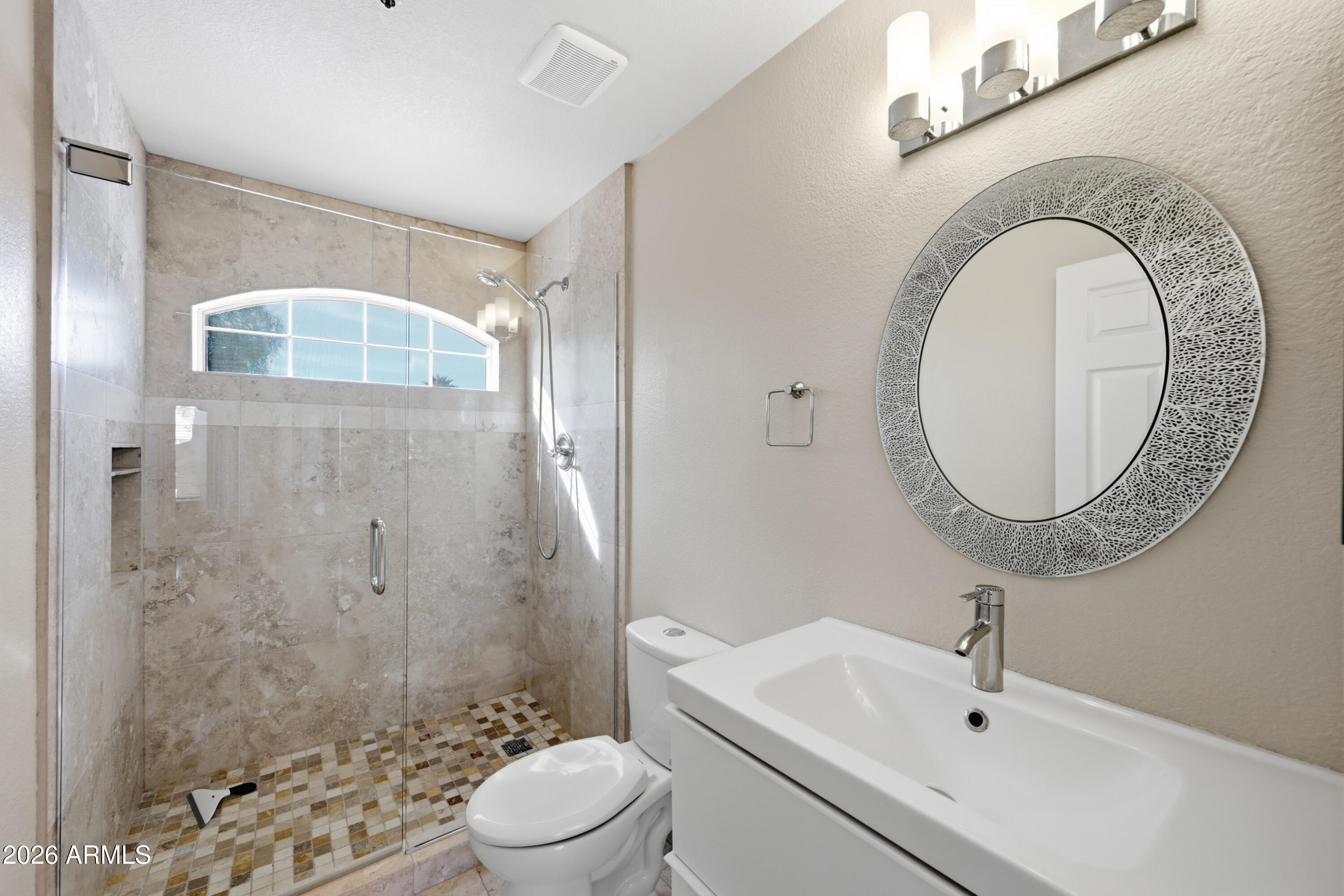 9502 East Presidio Road Scottsdale, AZ 85260 - Photo 34 of 39 a bathroom with a sink a toilet and shower