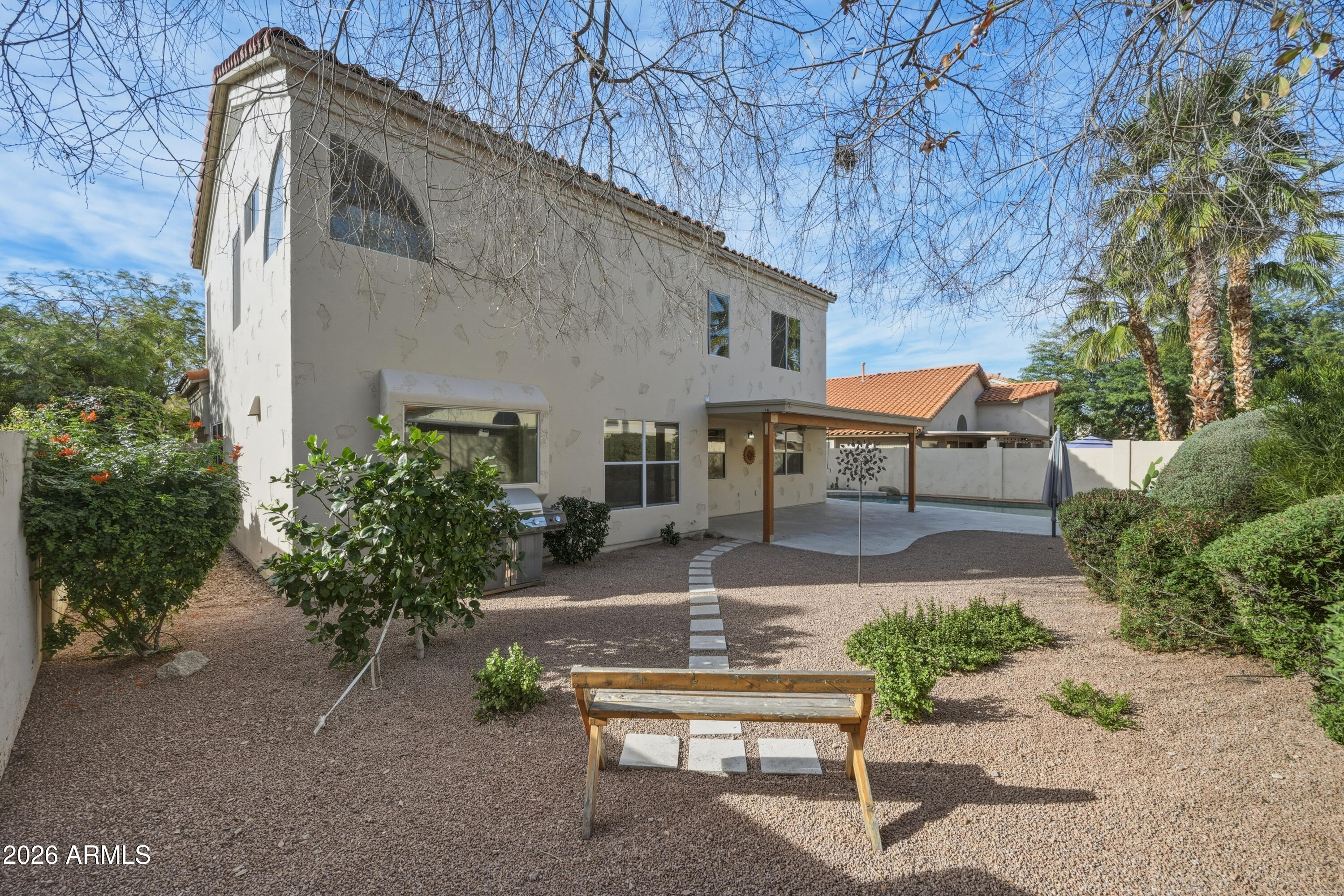 9502 East Presidio Road Scottsdale, AZ 85260 - Photo 35 of 39 a front view of a house with garden