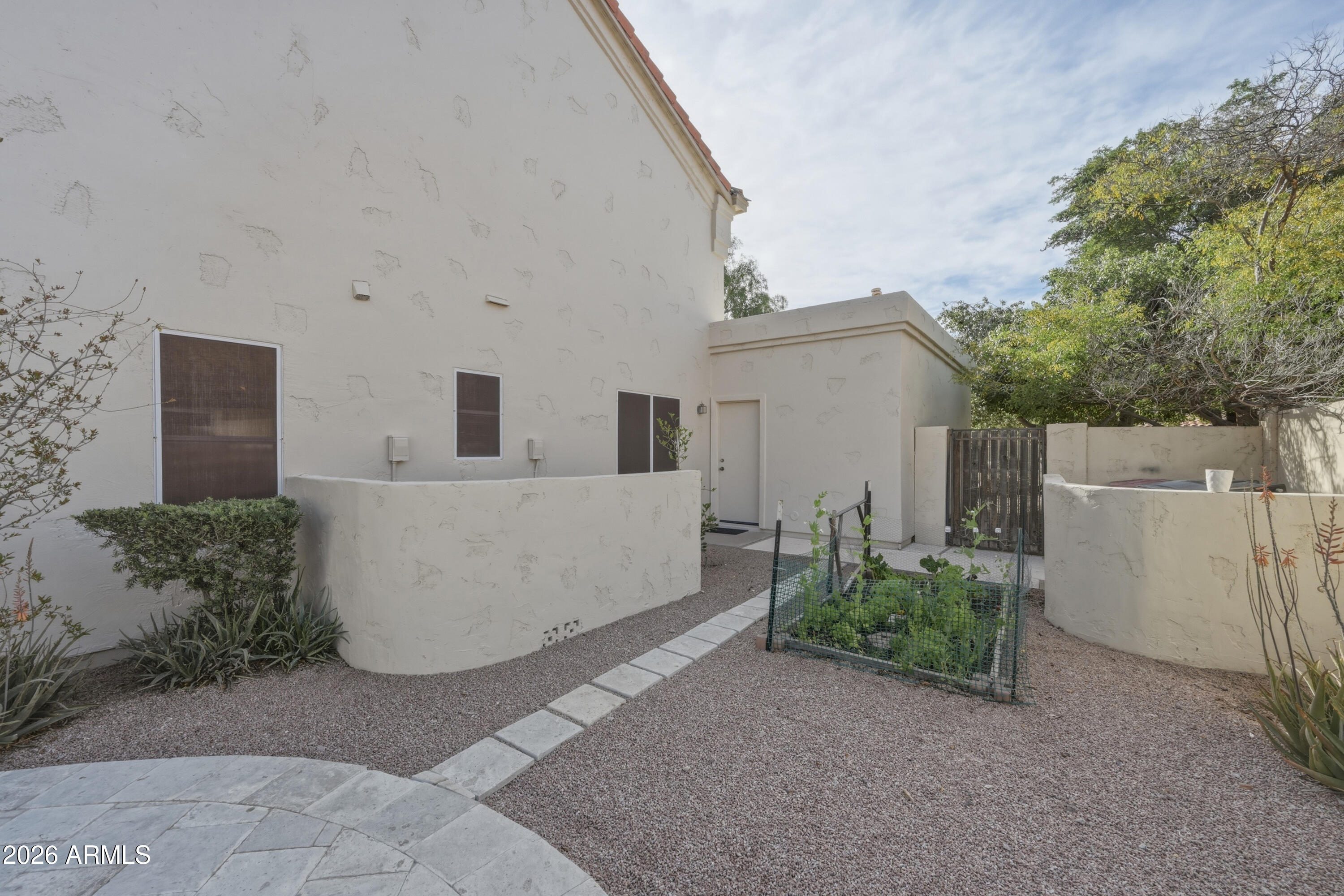 9502 East Presidio Road Scottsdale, AZ 85260 - Photo 37 of 39 front view of a house with a yard