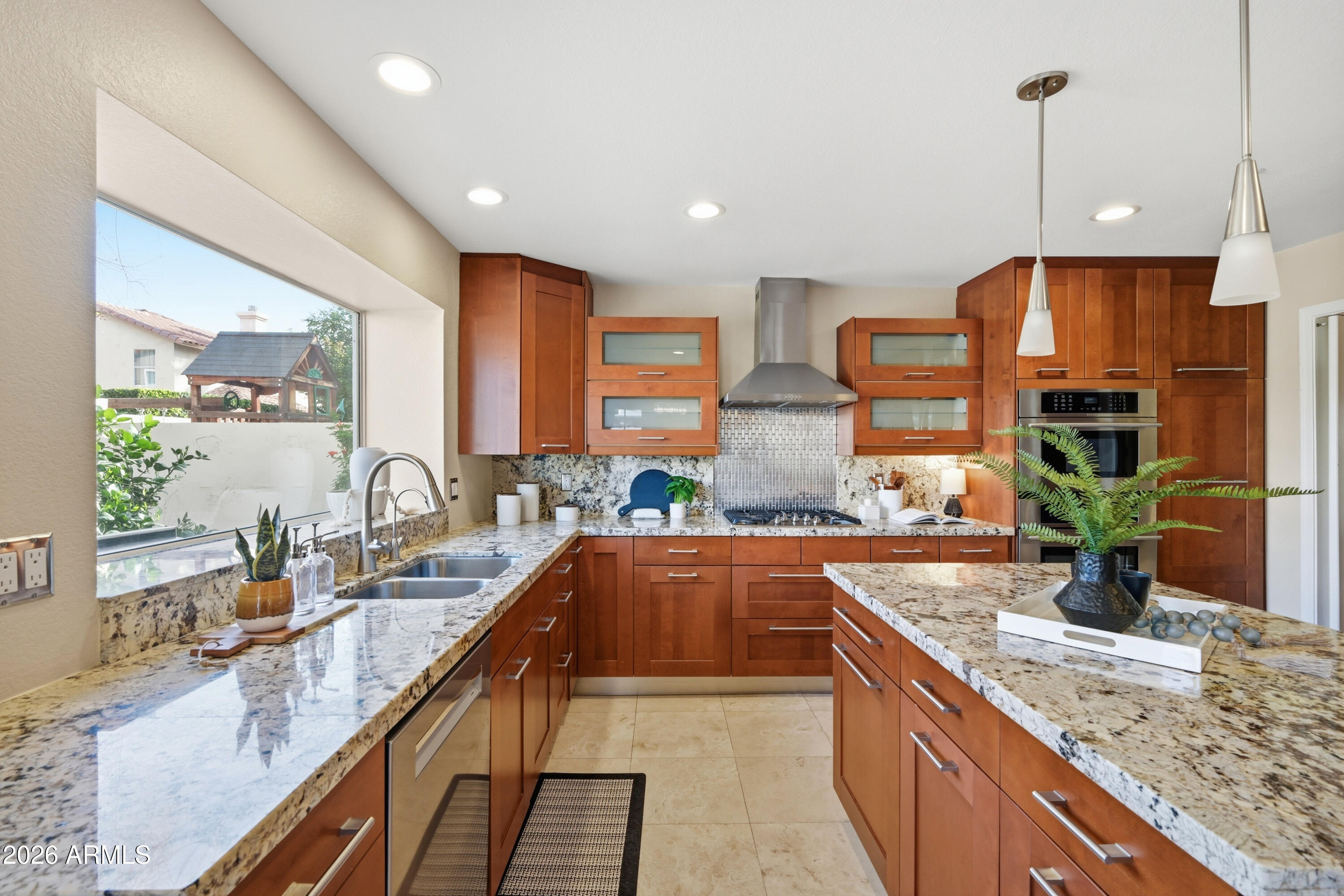 9502 East Presidio Road Scottsdale, AZ 85260 - Photo 3 of 39 a large kitchen with granite countertop a sink and a counter top space