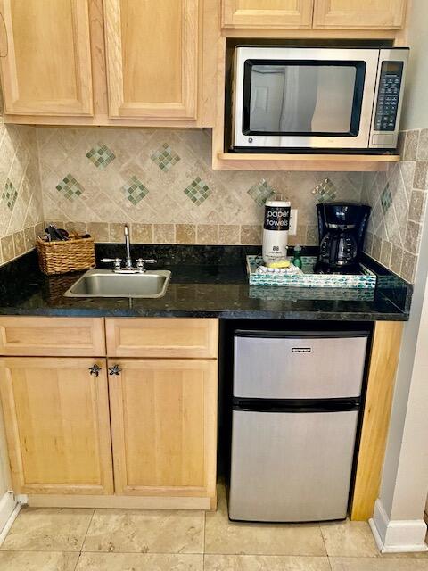 10343 East County Highway 30A, Unit B193 Inlet Beach, FL 32413 - Photo 11 of 22 a kitchen with granite countertop a sink and a microwave