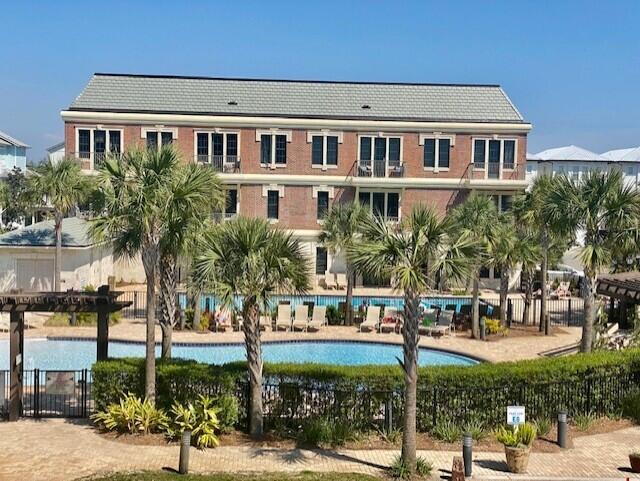 10343 East County Highway 30A, Unit B193 Inlet Beach, FL 32413 - Photo 20 of 22 a front view of a house with a garden