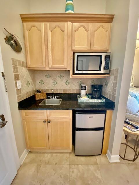 10343 East County Highway 30A, Unit B193 Inlet Beach, FL 32413 - Photo 10 of 22 a kitchen with stainless steel appliances granite countertop a sink and a cabinets