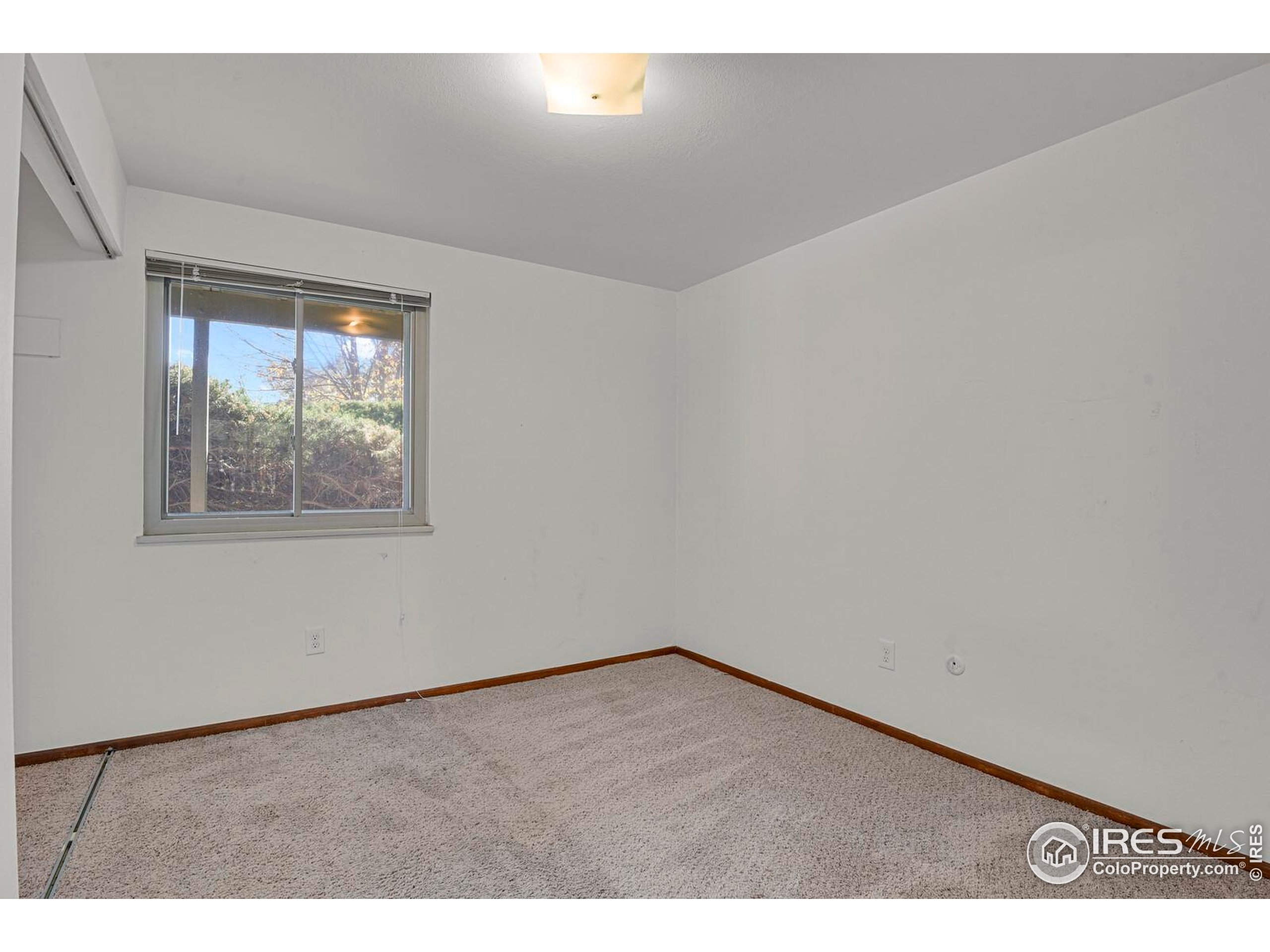 8050 Niwot Road, Unit 1 Niwot, CO 80503 - Photo 12 of 20 a view of an empty room and window