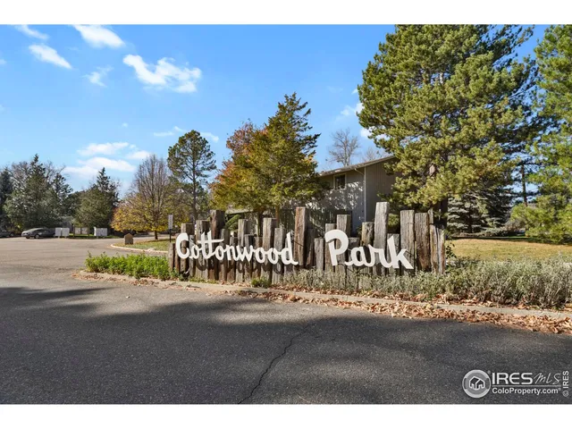 a building outdoor space with patio furniture and potted plants