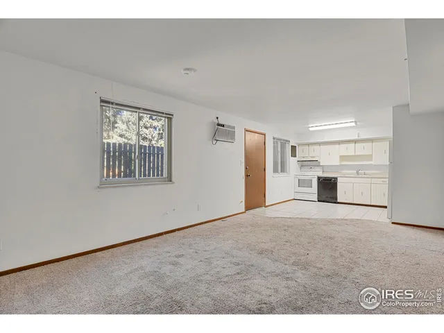 a big room with closet and windows