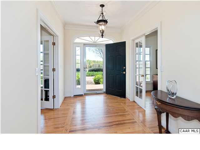 3434 Fosters Branch Road Charlottesville, VA 22911 - Photo 7 of 15 The foyer welcomes you with gleaming hardwood floors and French doors both to the left and right.