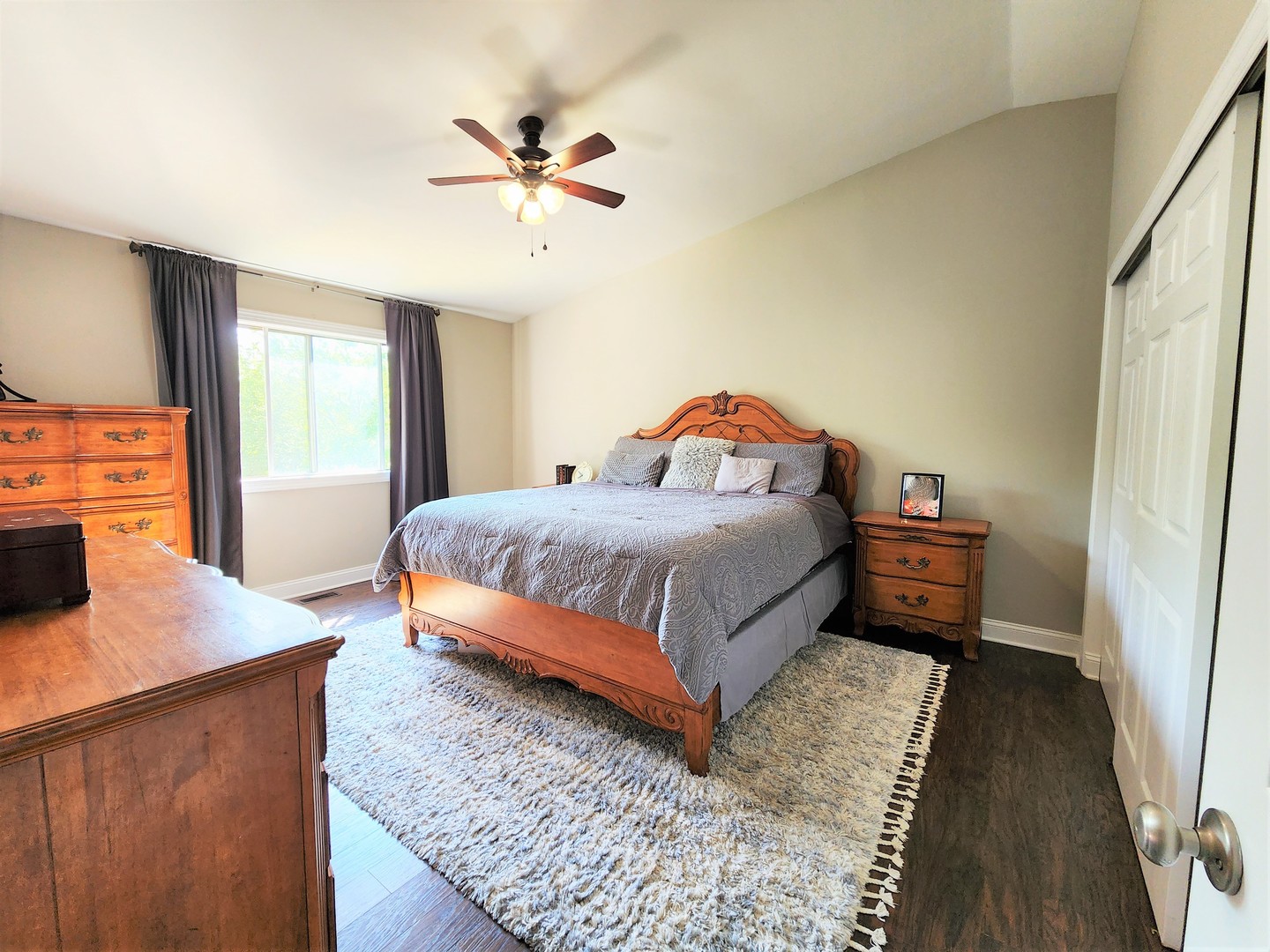 696 Dover Drive Elgin, IL 60120 - Photo 15 of 32 a bedroom with a bed and a dresser in it