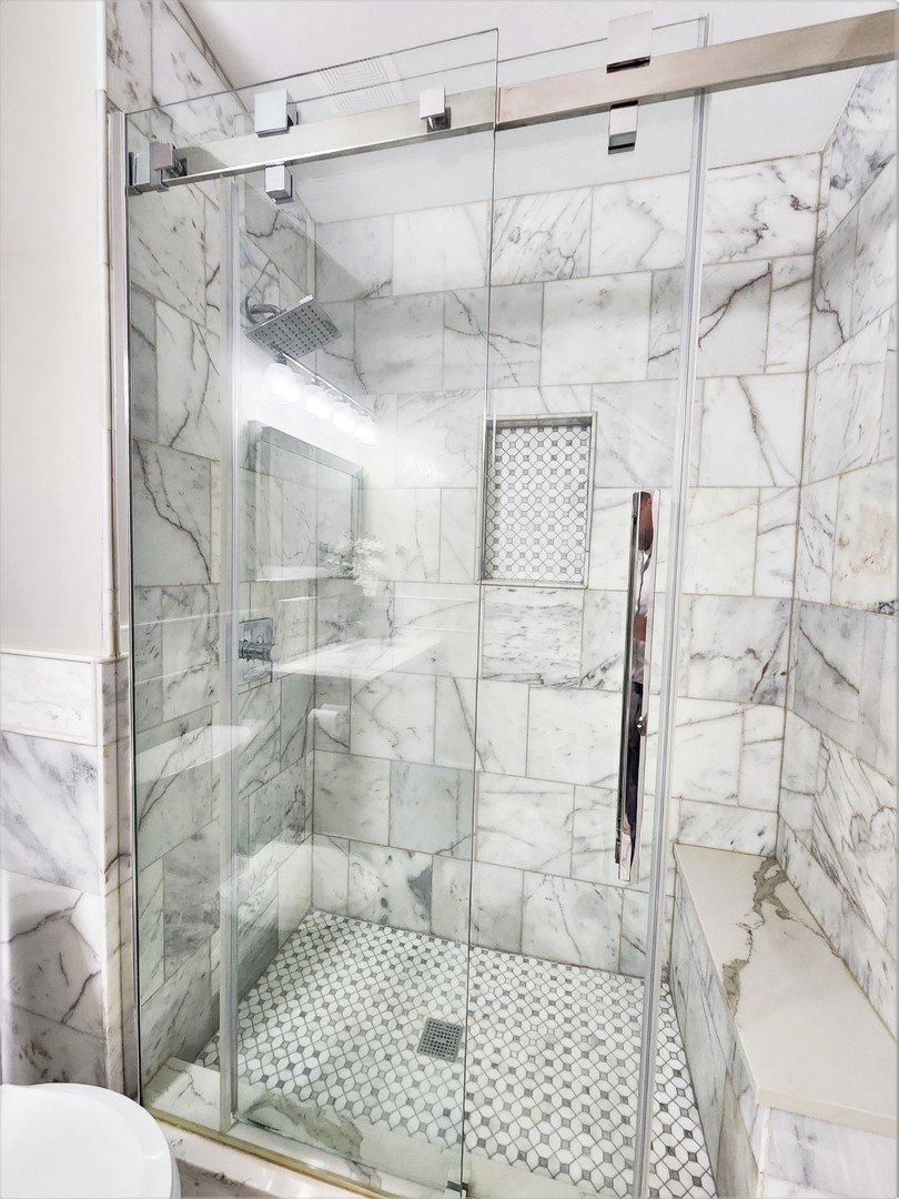 696 Dover Drive Elgin, IL 60120 - Photo 17 of 32 a bathroom with a shower