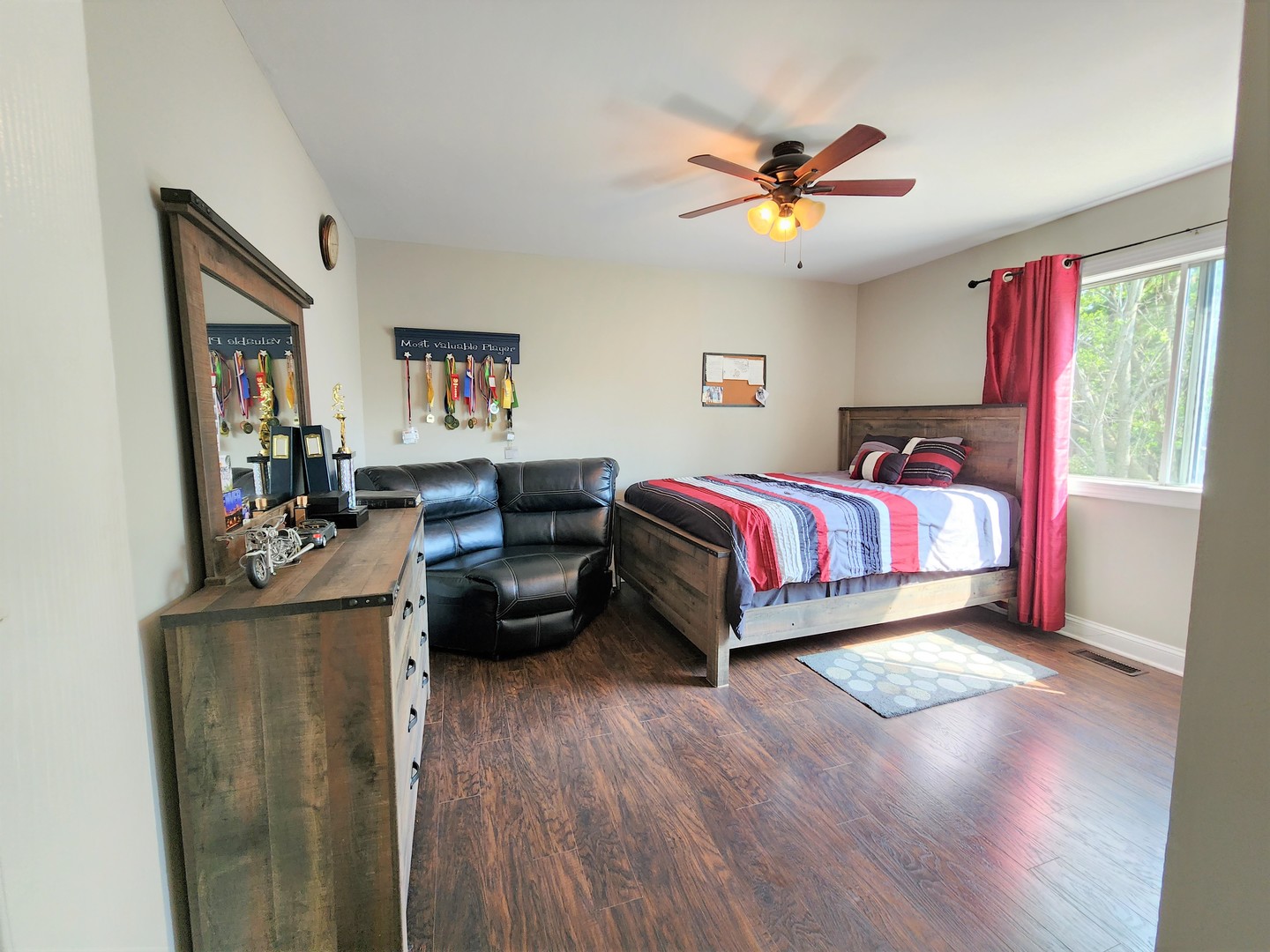 696 Dover Drive Elgin, IL 60120 - Photo 19 of 32 a bed room with a bed and a couch