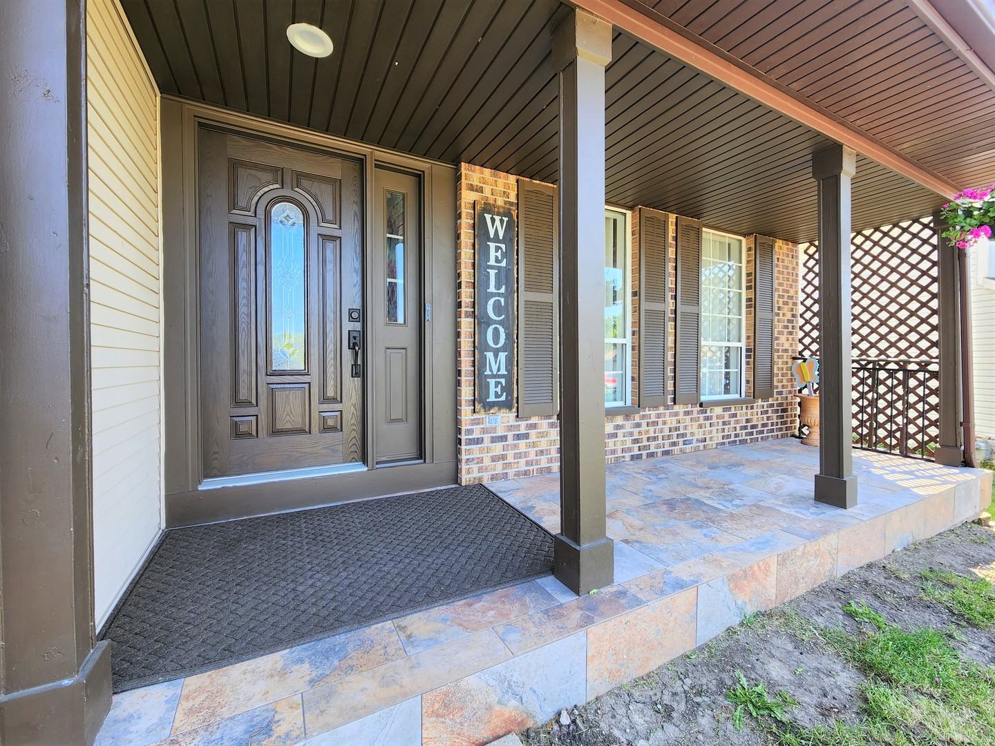 696 Dover Drive Elgin, IL 60120 - Photo 2 of 32 a view of a hallway with wooden walls and wooden fence