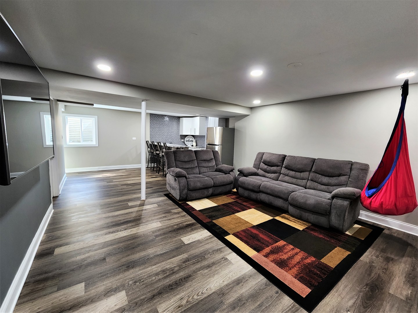 696 Dover Drive Elgin, IL 60120 - Photo 21 of 32 a living room with furniture and a rug