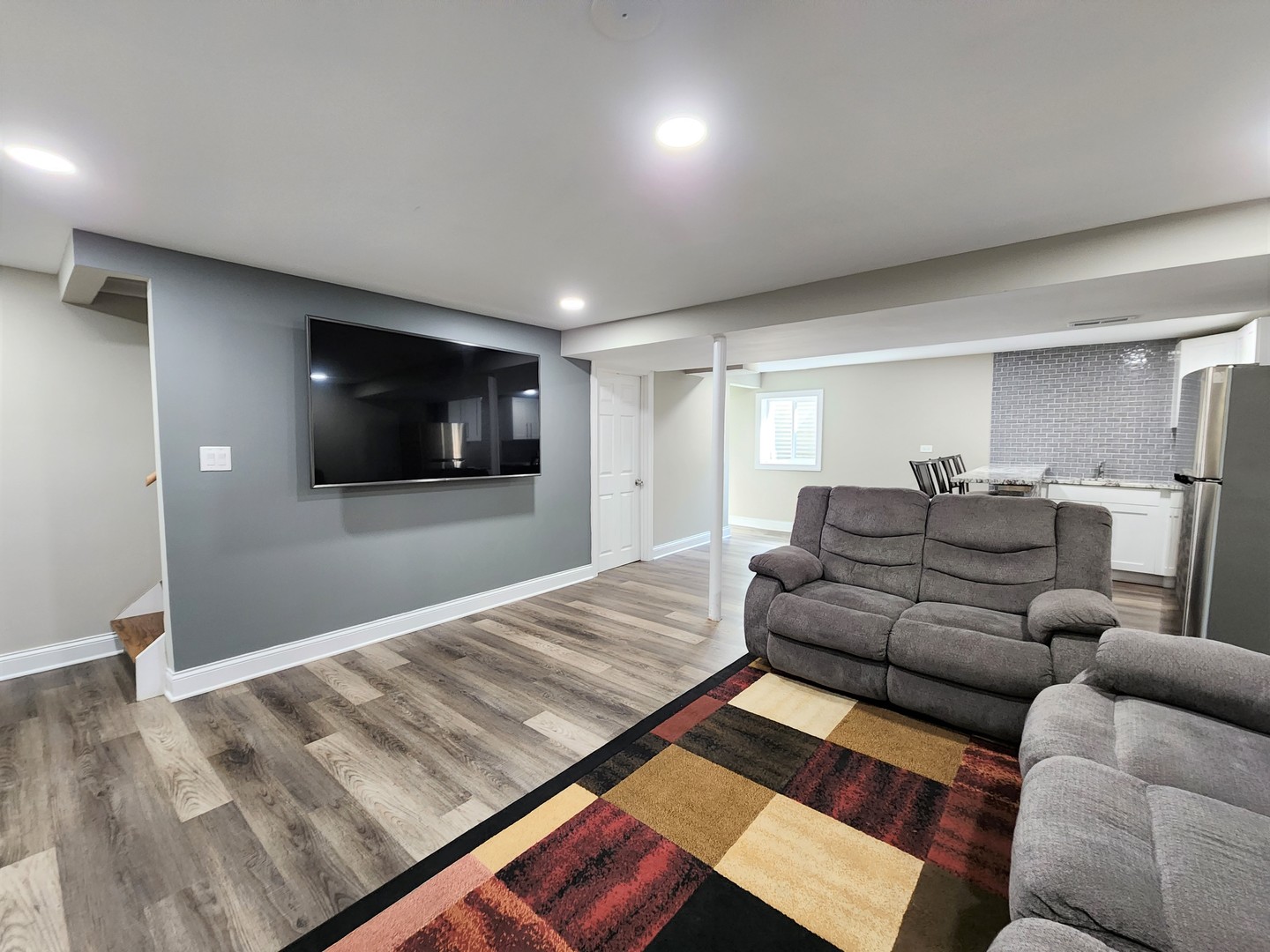 696 Dover Drive Elgin, IL 60120 - Photo 22 of 32 a living room with furniture and a flat screen tv