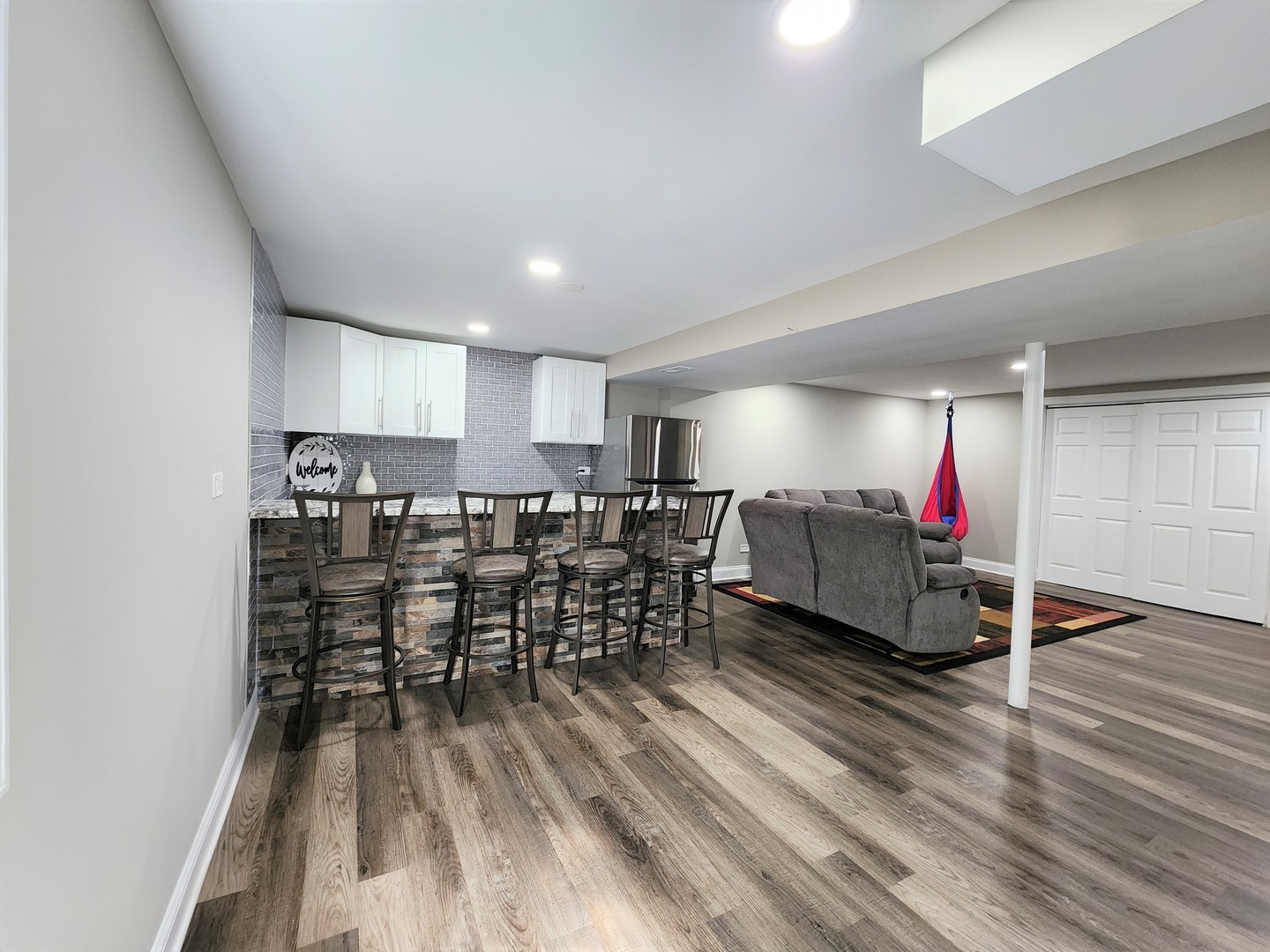 696 Dover Drive Elgin, IL 60120 - Photo 25 of 32 a living room with furniture and kitchen view