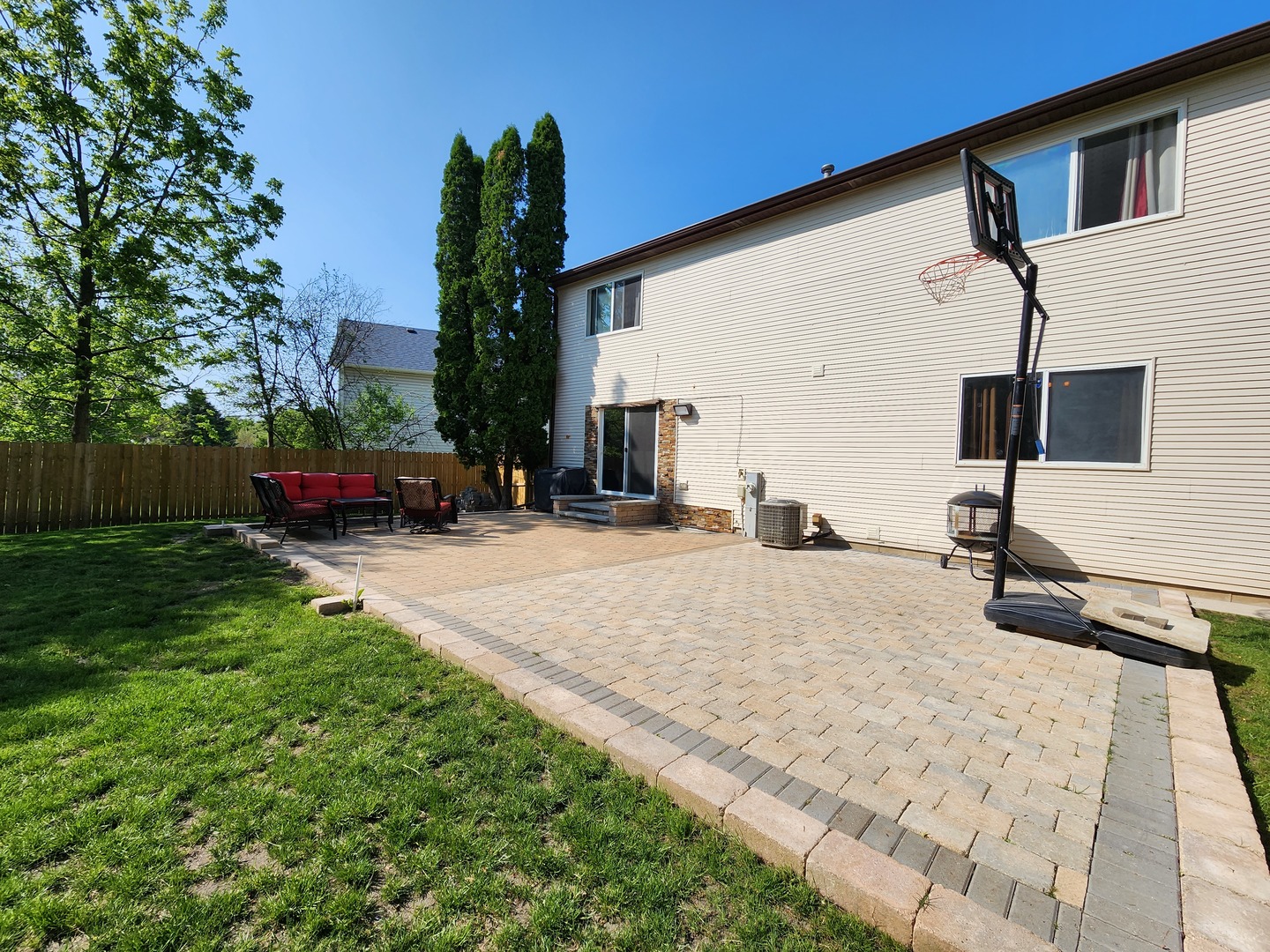 696 Dover Drive Elgin, IL 60120 - Photo 29 of 32 a view of a backyard with sitting area