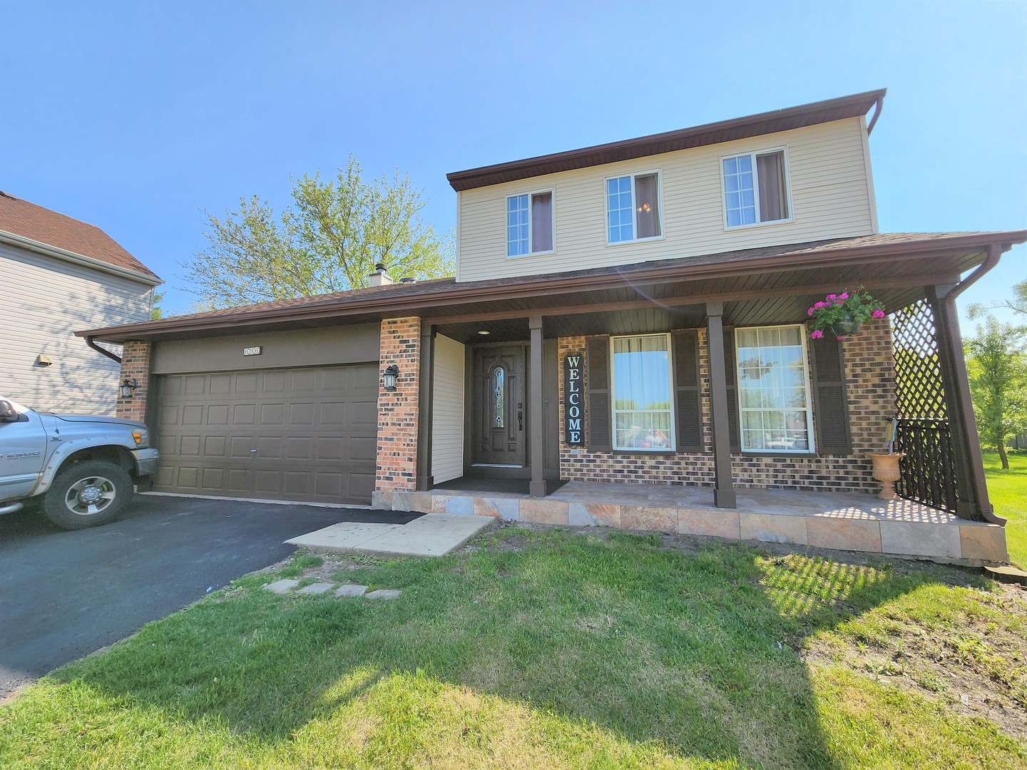 696 Dover Drive Elgin, IL 60120 - Photo 32 of 32 a view of a house with a yard and plants