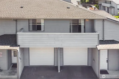 a front view of a house with garage