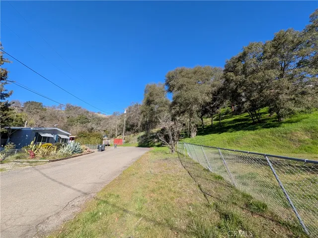 a view of a road with a yard