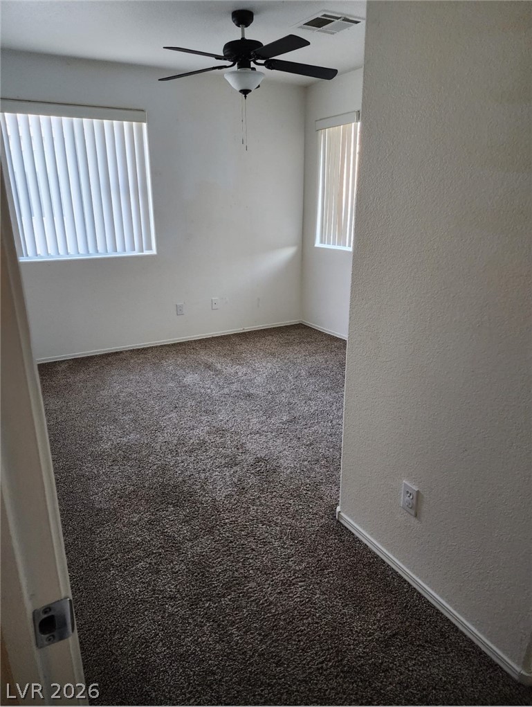 11901 Fairfax Ridge Street Las Vegas, NV 89183 - Photo 31 of 46 Carpeted spare room featuring a textured wall and a ceiling fan