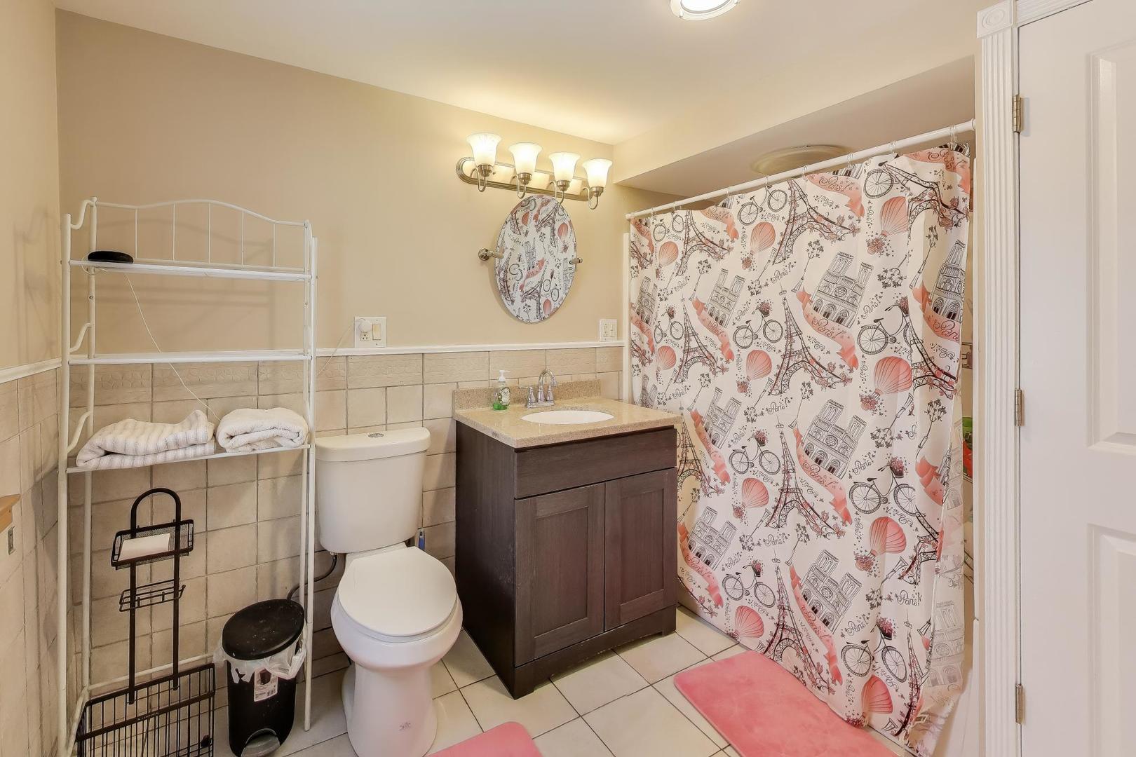 29 Iowa Avenue Addison, IL 60101 - Photo 13 of 22 a bathroom with a granite countertop toilet sink and mirror