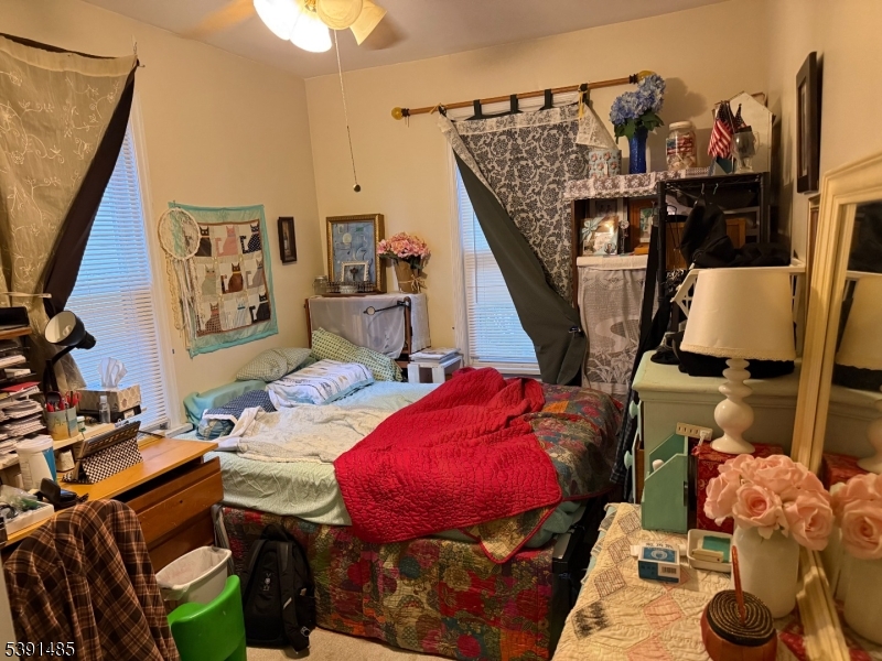 27 Passaic Avenue, Unit 2 Nutley, NJ 07110 - Photo 15 of 18 a living room with furniture and a flat screen tv