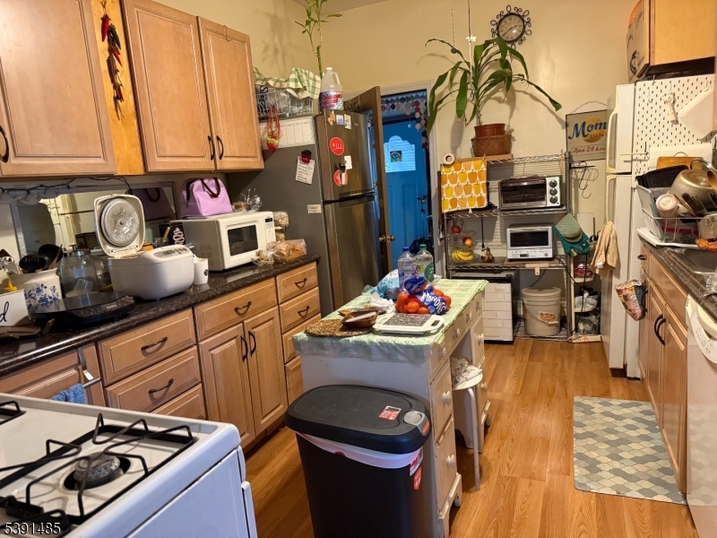 27 Passaic Avenue, Unit 2 Nutley, NJ 07110 - Photo 16 of 18 a kitchen with stainless steel appliances granite countertop a stove a sink and dishwasher