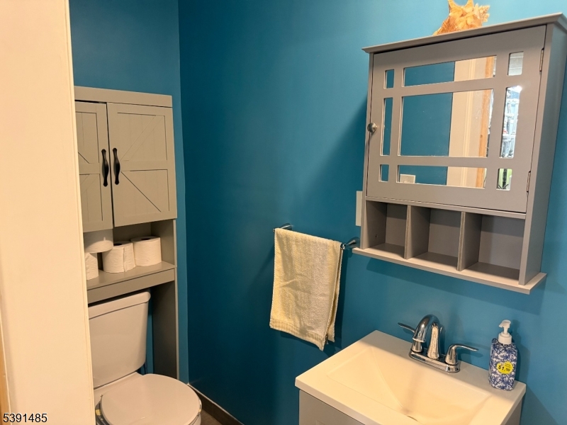 27 Passaic Avenue, Unit 2 Nutley, NJ 07110 - Photo 17 of 18 a bathroom with a toilet and a sink