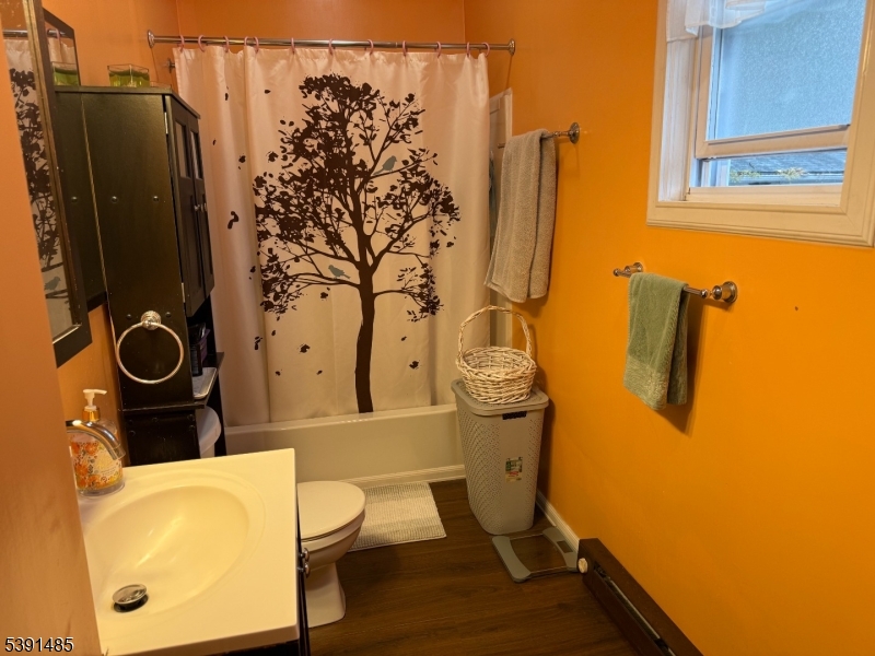 27 Passaic Avenue, Unit 2 Nutley, NJ 07110 - Photo 7 of 18 a bathroom with a sink toilet and shower