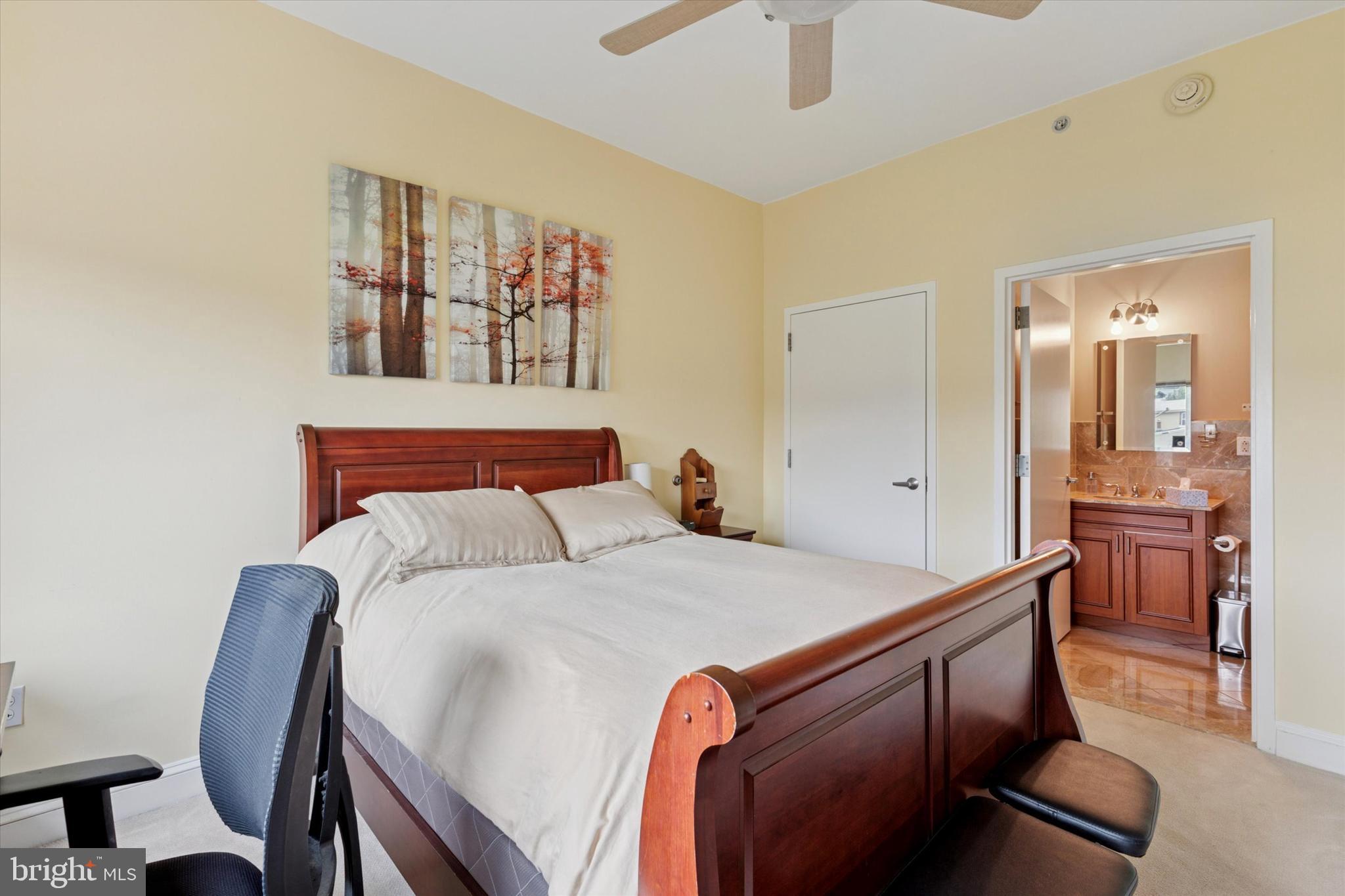 3750 Main Street, Unit 709 Philadelphia, PA 19127 - Photo 12 of 15 a bed room with a bed and a chair