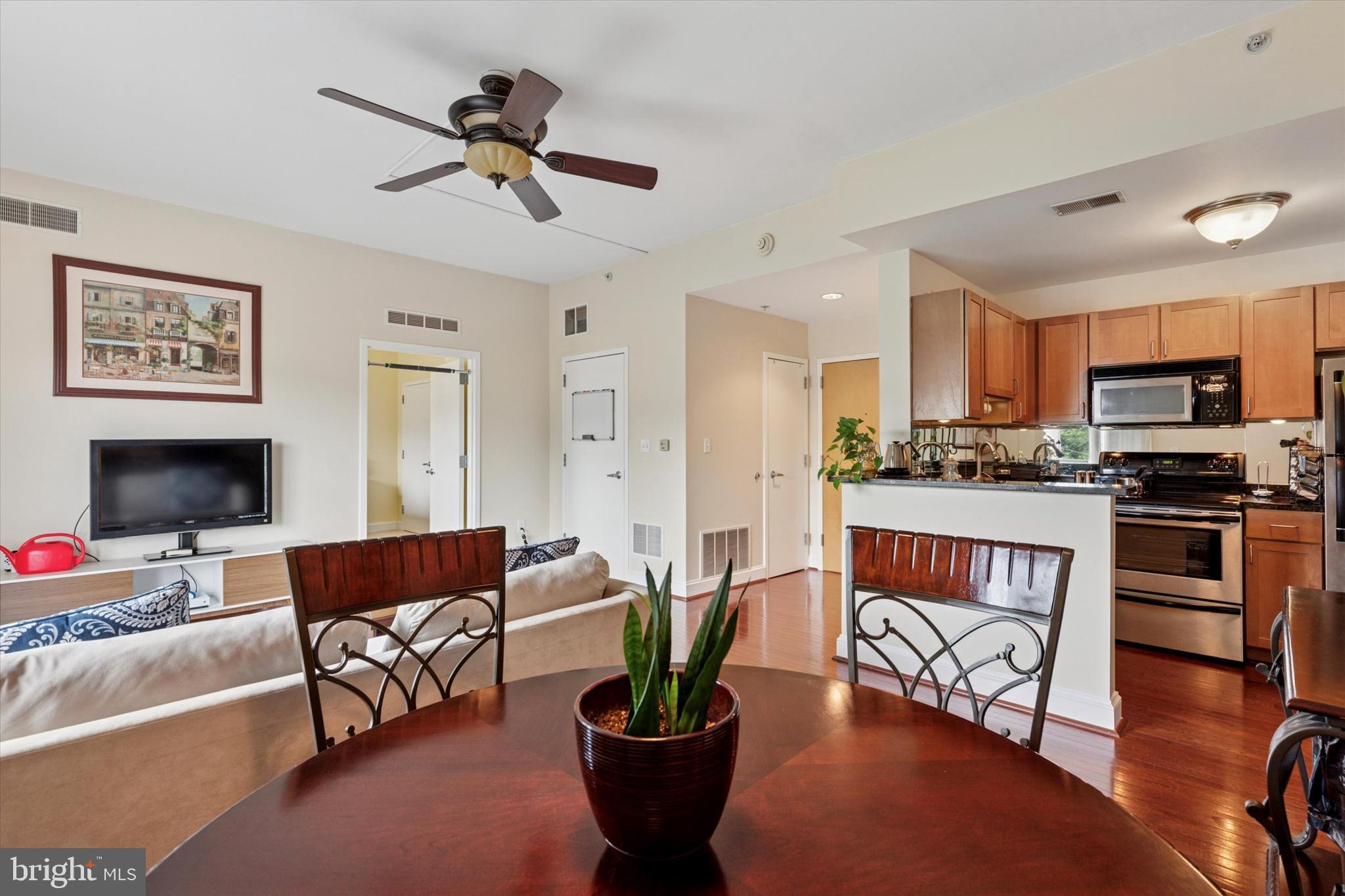 3750 Main Street, Unit 709 Philadelphia, PA 19127 - Photo 13 of 15 a living room with furniture and a flat screen tv