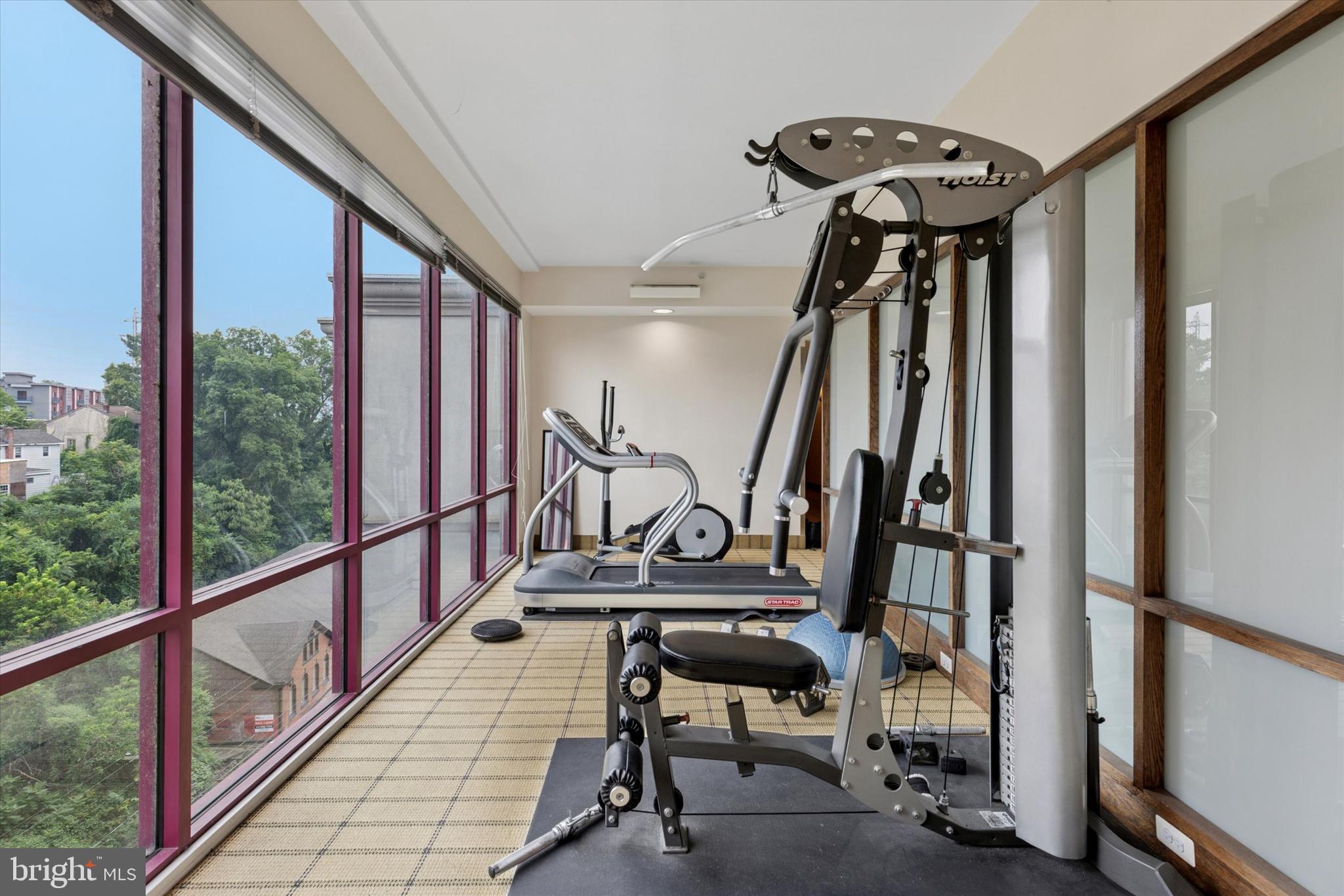 3750 Main Street, Unit 709 Philadelphia, PA 19127 - Photo 14 of 15 a view of a hallway with wooden floor and door
