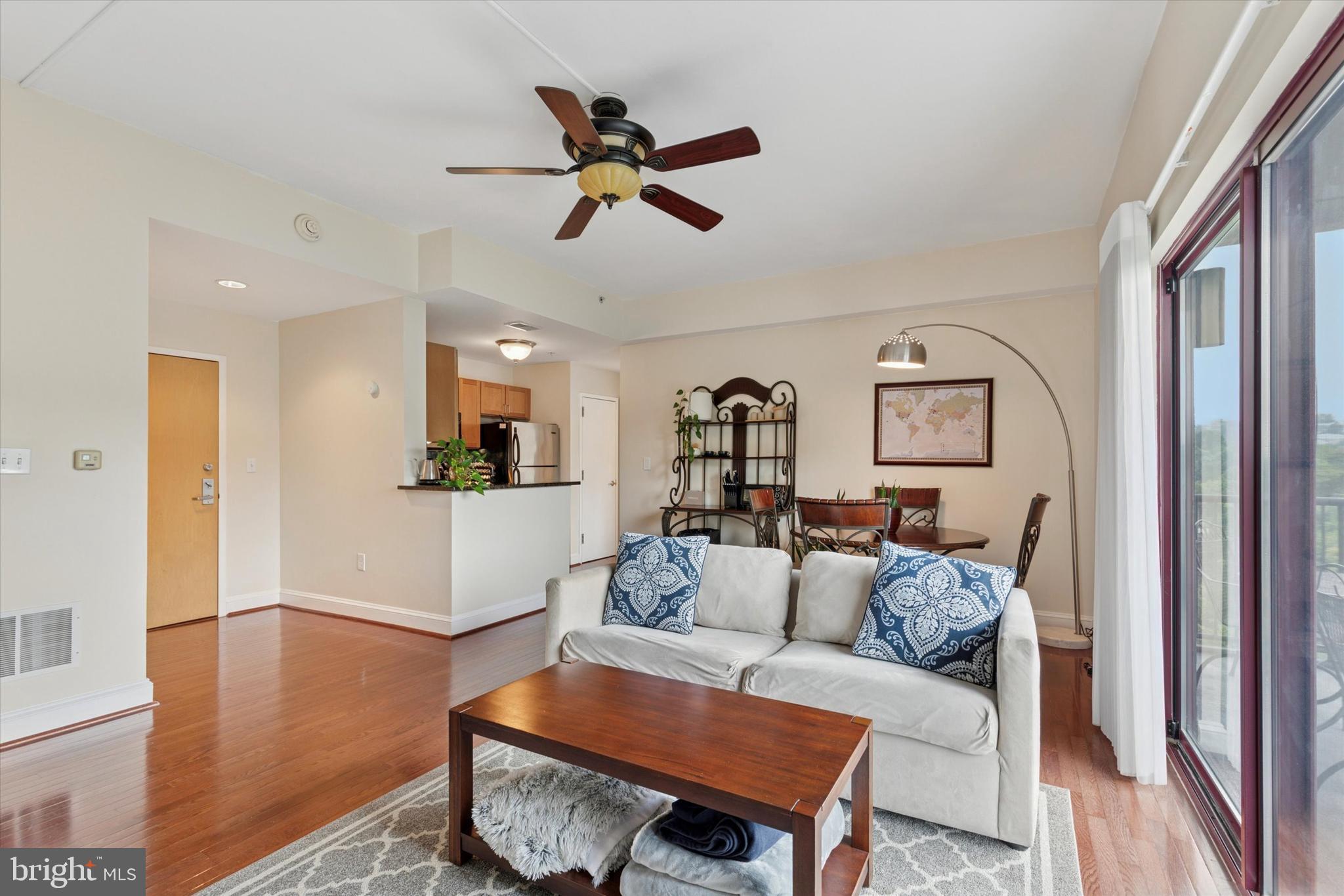 3750 Main Street, Unit 709 Philadelphia, PA 19127 - Photo 4 of 15 a living room with furniture and a wooden floor