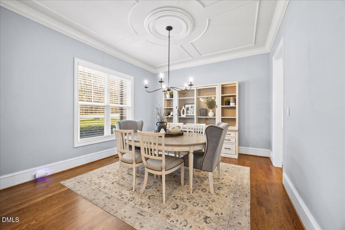 325 Forest Bridge Road Youngsville, NC 27596 - Photo 12 of 99 a view of a dining room with furniture window and wooden floor