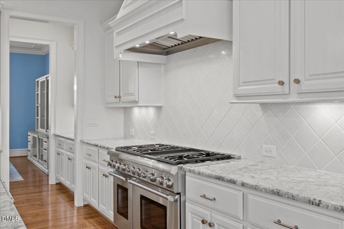 325 Forest Bridge Road Youngsville, NC 27596 - Photo 20 of 99 a kitchen with granite countertop cabinets and steel stainless steel appliances