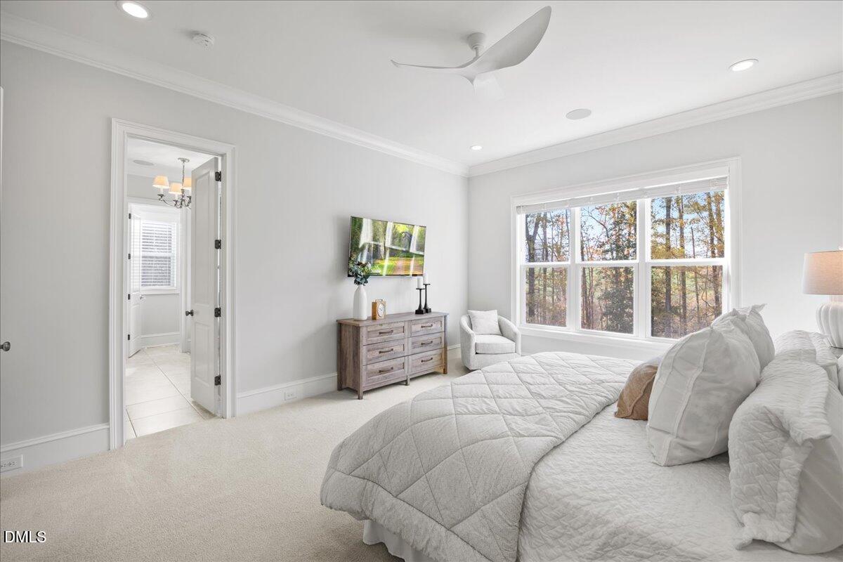 325 Forest Bridge Road Youngsville, NC 27596 - Photo 26 of 99 a bedroom with a bed and a large window
