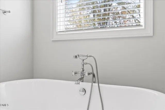 a bathroom with a granite countertop sink double and mirror