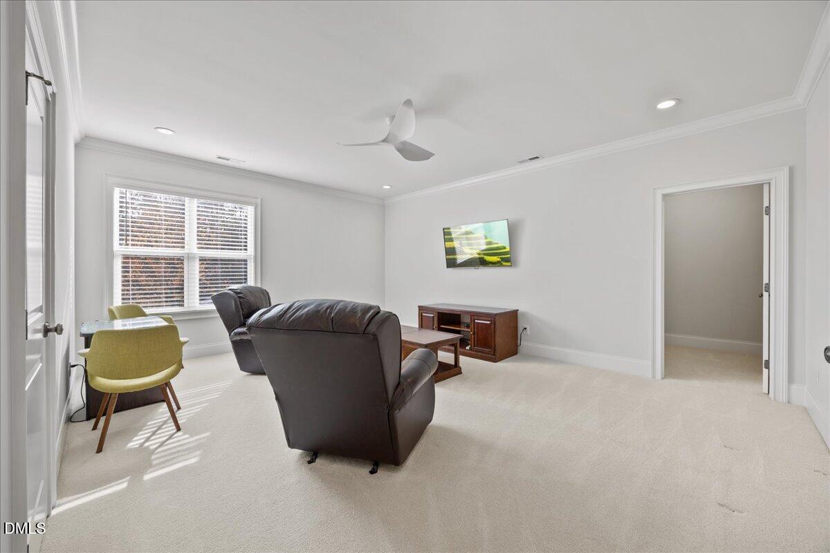 325 Forest Bridge Road Youngsville, NC 27596 - Photo 34 of 99 a living room with furniture and a window
