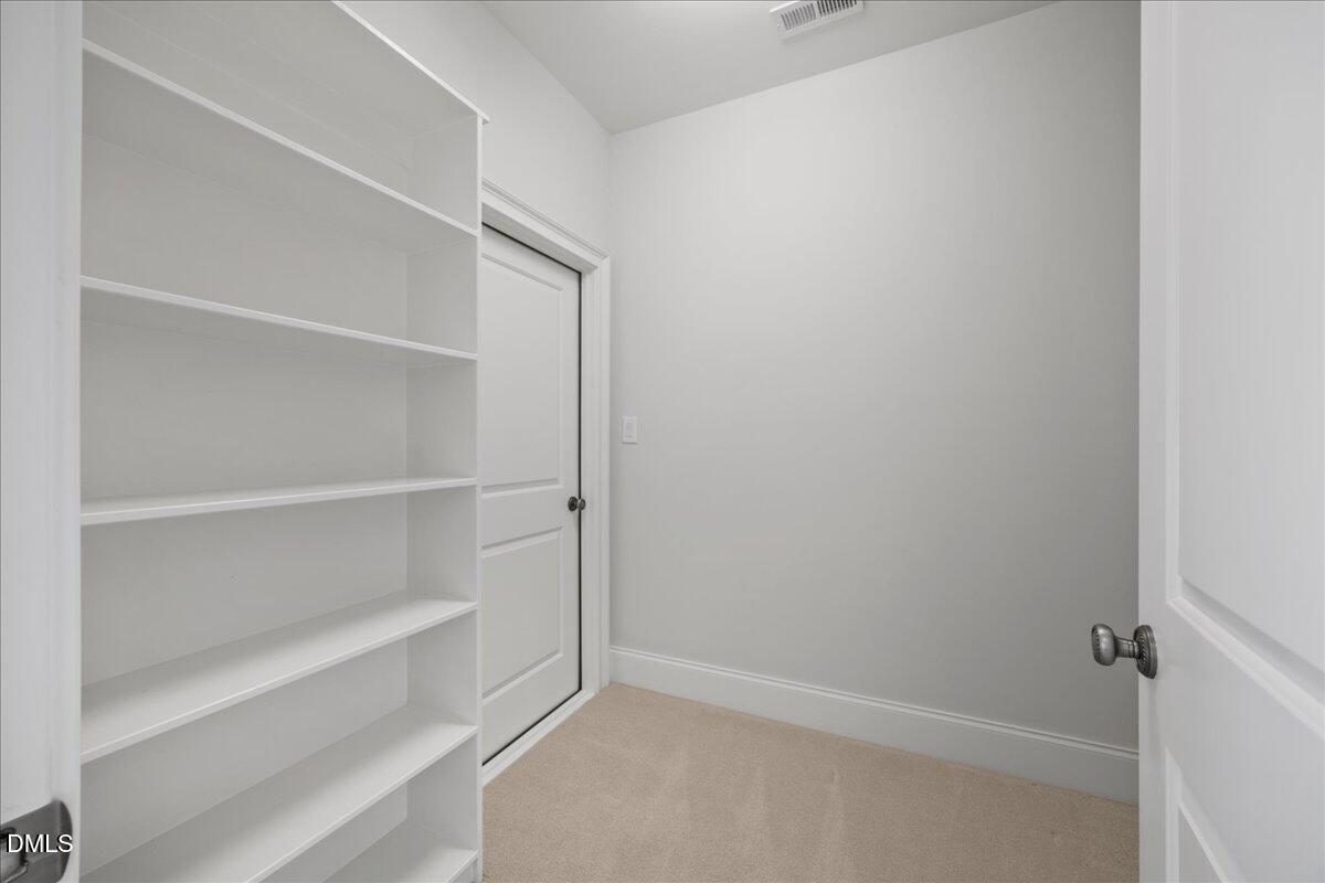 325 Forest Bridge Road Youngsville, NC 27596 - Photo 36 of 99 a view of an empty walk in closet