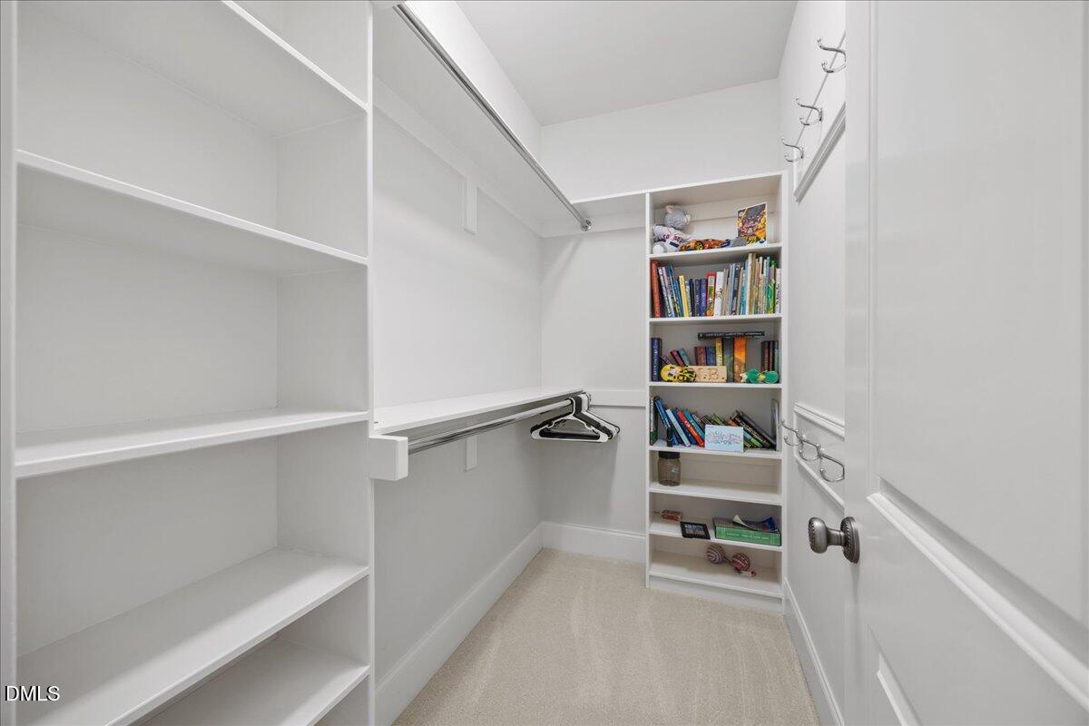 325 Forest Bridge Road Youngsville, NC 27596 - Photo 45 of 99 a view of a room with shelves