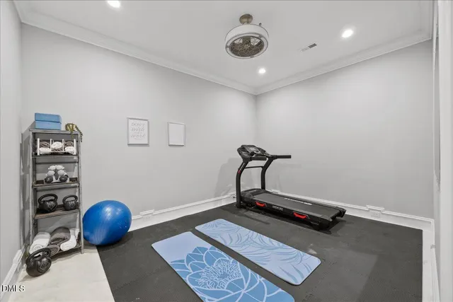 a view of a large kitchen with a stove and wooden floor