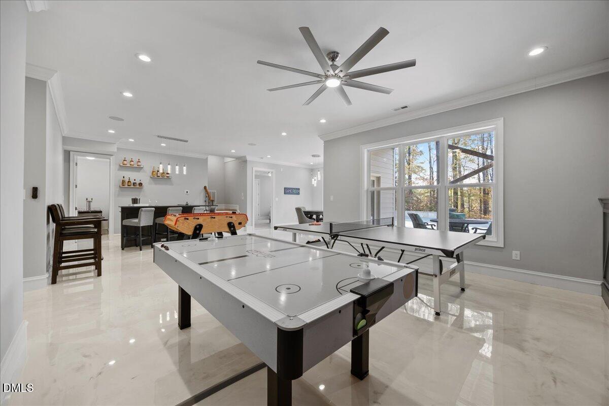 325 Forest Bridge Road Youngsville, NC 27596 - Photo 53 of 99 a living room with stainless steel appliances furniture a window and a kitchen view