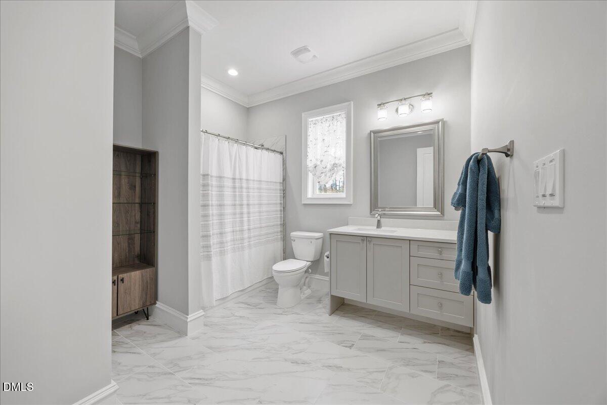 325 Forest Bridge Road Youngsville, NC 27596 - Photo 60 of 99 a bathroom with a sink toilet and shower