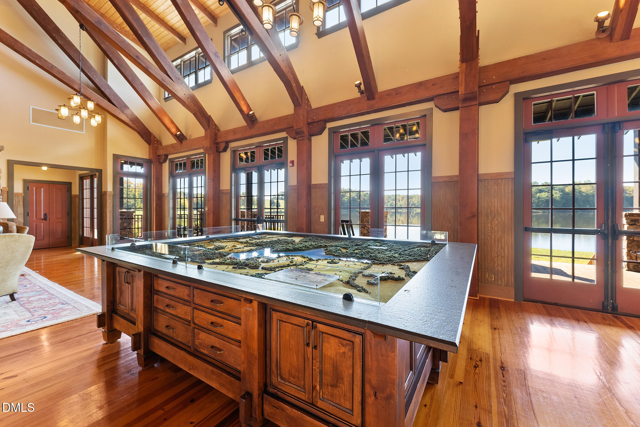 325 Forest Bridge Road Youngsville, NC 27596 - Photo 85 of 99 a view of a large kitchen with a stove and wooden floor