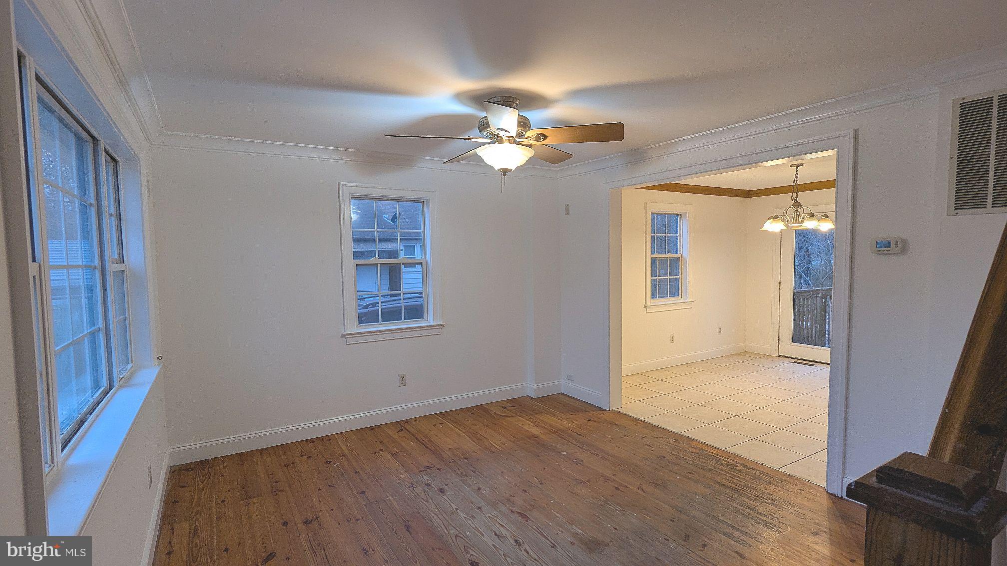 21 Sycamore Road Pennsville, NJ 08070 - Photo 14 of 31 wooden floor in an empty room with a window