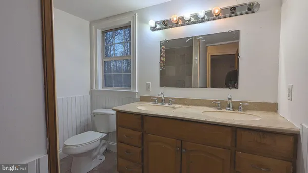 a bathroom with a tub and sink