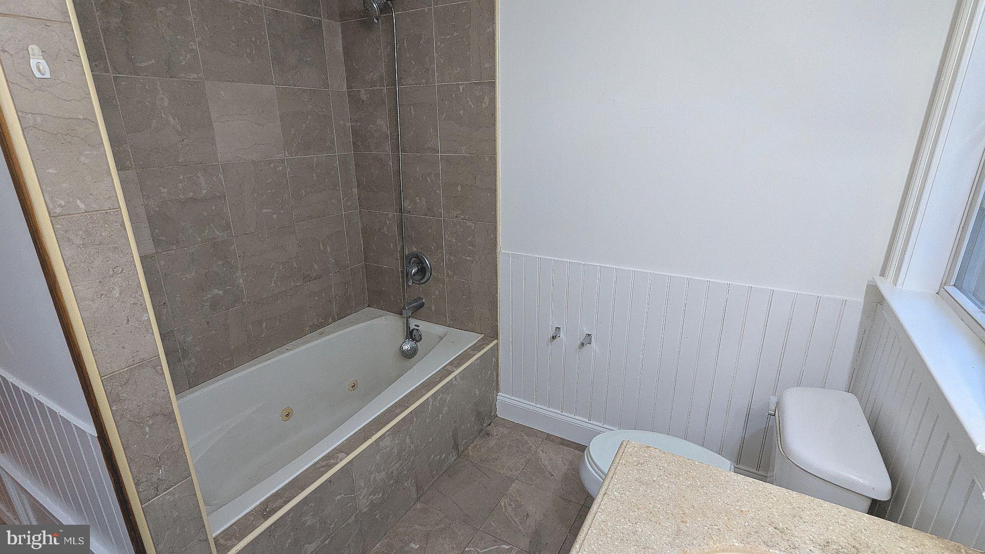 21 Sycamore Road Pennsville, NJ 08070 - Photo 25 of 31 a bathroom with a tub and sink