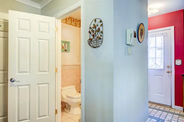 a bathroom with a walk in closet and a window